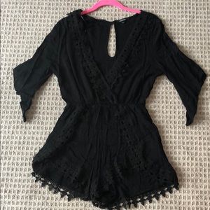 Black v neck romper with lace detail